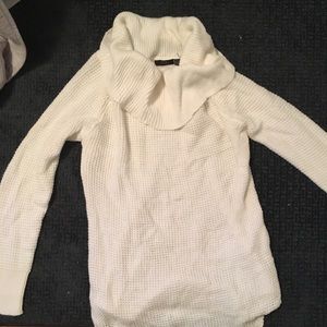 White knit sweater with low turtleneck collar